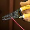 imageKlein Tools K1412 Wire Cutter  Stripper Made in USA Dual NM Cable Stripper and Cutter for Solid Copper Strips 12 and 14 AWG